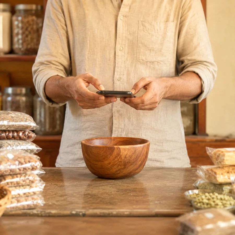 A shopkeeper photographing the counter to post it